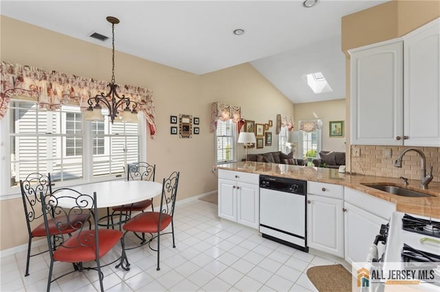 12 Wellfleet St, Monroe, NJ 08831 - kitchen with white appliances, a sink, lofted ceiling, a peninsula, and a chandelier