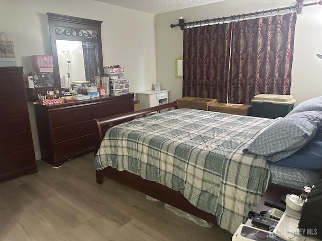 167 Rachel Ct, Franklin Twsp, NJ 08823 - bedroom featuring wood finished floors and a textured ceiling