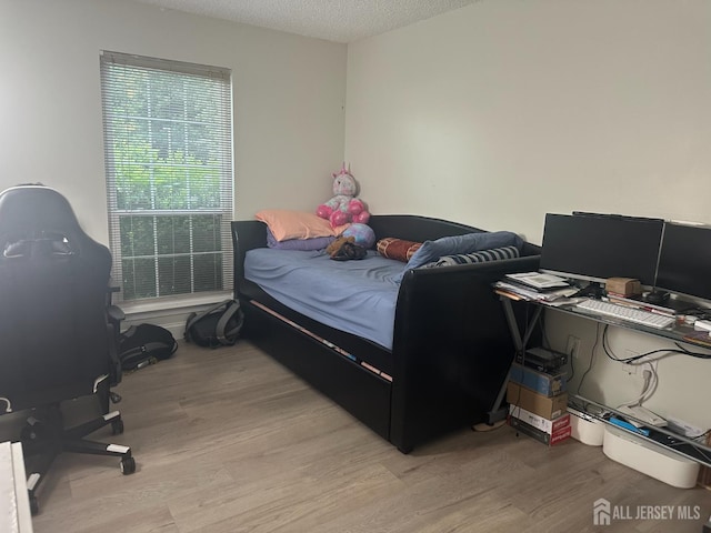 167 Rachel Ct, Franklin Twsp, NJ 08823 - bedroom featuring light wood-style floors, a desk, and a textured ceiling