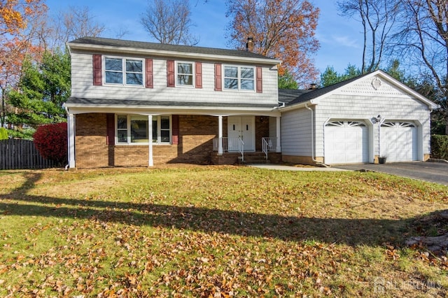 view of front property with a garage and a front yard