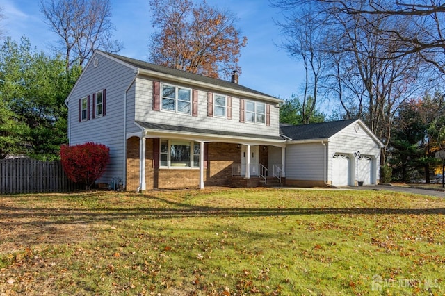 view of front of property featuring a garage and a front yard