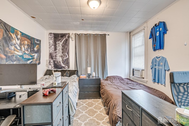 bedroom with crown molding and cooling unit