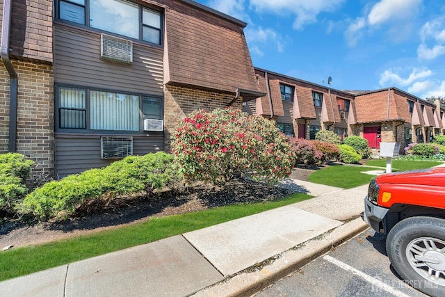 1133 Livingston Ave Unit 11C, North Brunswick, NJ 08902 - view of property with uncovered parking and a residential view