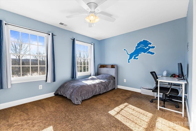 bedroom featuring carpet floors, baseboards, ceiling fan, and visible vents