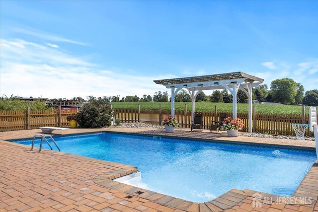 view of pool featuring fence, a pergola, a fenced in pool, and a patio