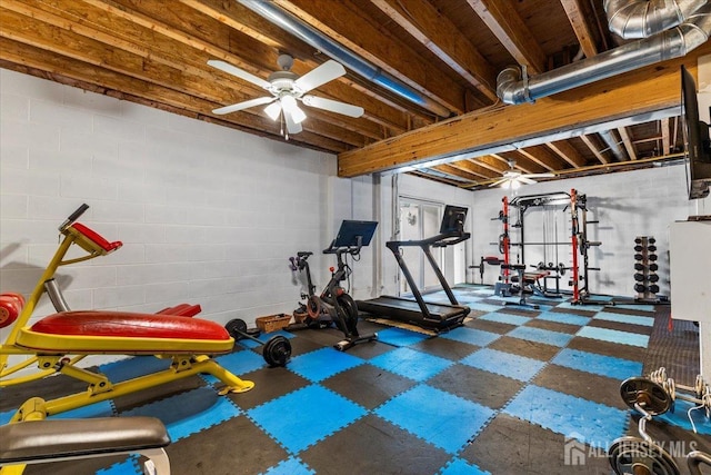 workout area with ceiling fan and tile patterned floors