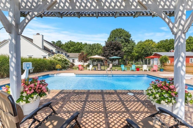 view of pool with fence, a fenced in pool, and a patio