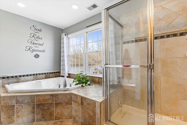 full bathroom with recessed lighting, visible vents, a bath, and a stall shower