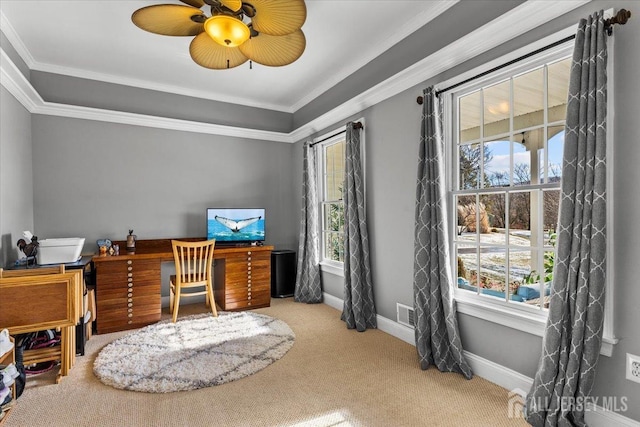 carpeted office featuring crown molding, a ceiling fan, and baseboards