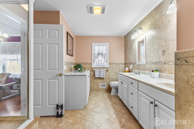 159 Bryans Rd, Washington Twp, NJ 08827 - full bath featuring tile walls, double vanity, and tile patterned floors