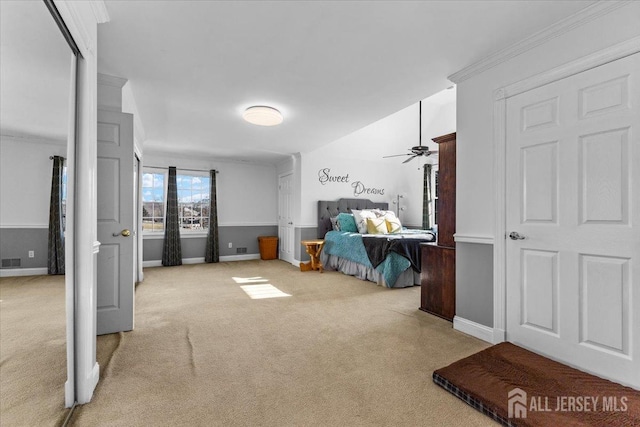 bedroom featuring carpet floors, baseboards, crown molding, and visible vents