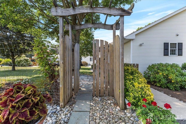 view of gate featuring fence