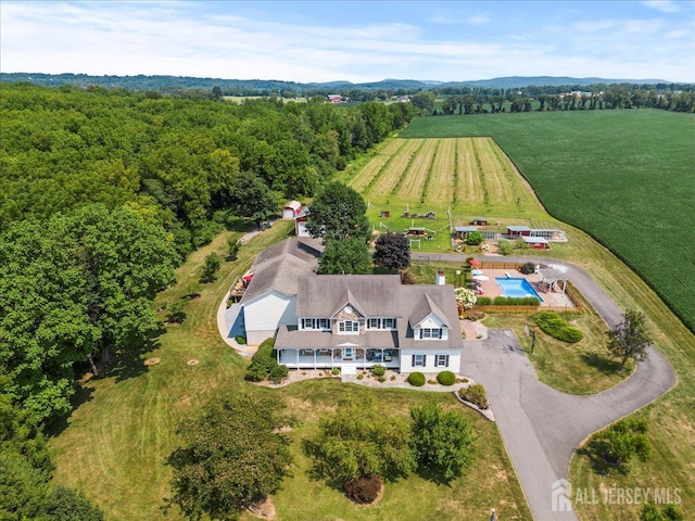 birds eye view of property with a rural view