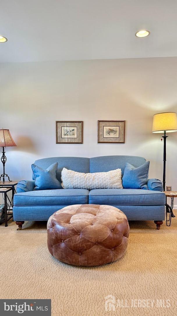 living room featuring carpet floors and recessed lighting