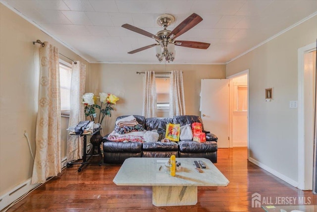 living room with ceiling fan, crown molding, and dark wood-type flooring