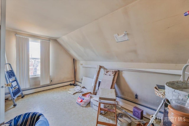 bonus room with carpet, vaulted ceiling, and a baseboard heating unit