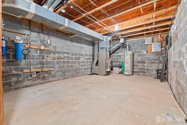 basement featuring heating unit and water heater