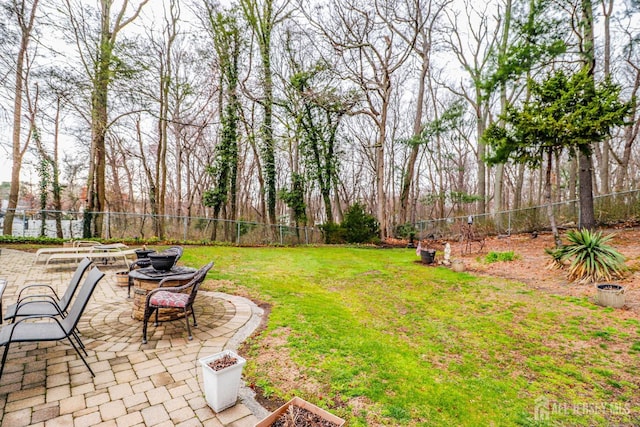 17 Morningside Dr, Old Bridge, NJ 08857 - view of yard with a fire pit, a patio area, and a fenced backyard