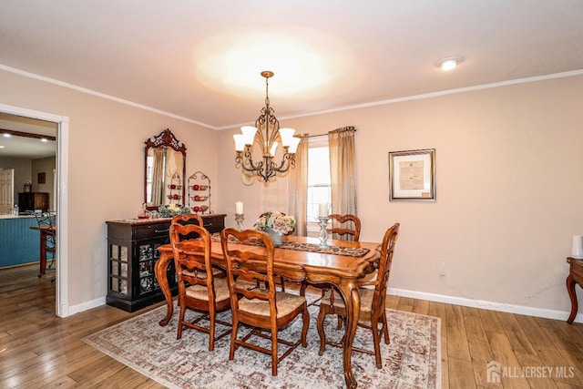 17 Morningside Dr, Old Bridge, NJ 08857 - dining room featuring a notable chandelier, crown molding, and hardwood / wood-style flooring
