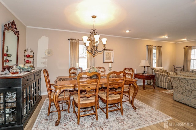 17 Morningside Dr, Old Bridge, NJ 08857 - dining area featuring baseboards, ornamental molding, a chandelier, and wood finished floors
