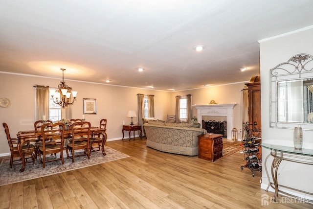 17 Morningside Dr, Old Bridge, NJ 08857 - living room with light wood-style flooring, baseboards, ornamental molding, a chandelier, and a fireplace