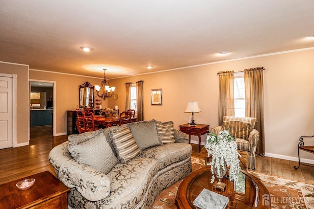 17 Morningside Dr, Old Bridge, NJ 08857 - living area featuring ornamental molding, a notable chandelier, baseboards, and wood finished floors