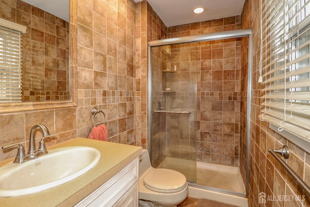 17 Morningside Dr, Old Bridge, NJ 08857 - bathroom featuring a stall shower, vanity, tile walls, and toilet