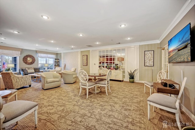 living area featuring ornamental molding, light colored carpet, and recessed lighting