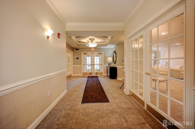 interior space with baseboards, french doors, and crown molding