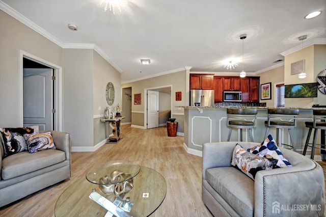 living room featuring light wood-style floors, baseboards, and ornamental molding