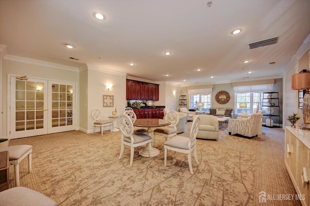 dining area featuring recessed lighting, visible vents, baseboards, ornamental molding, and french doors