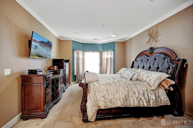 bedroom featuring baseboards, crown molding, and light colored carpet