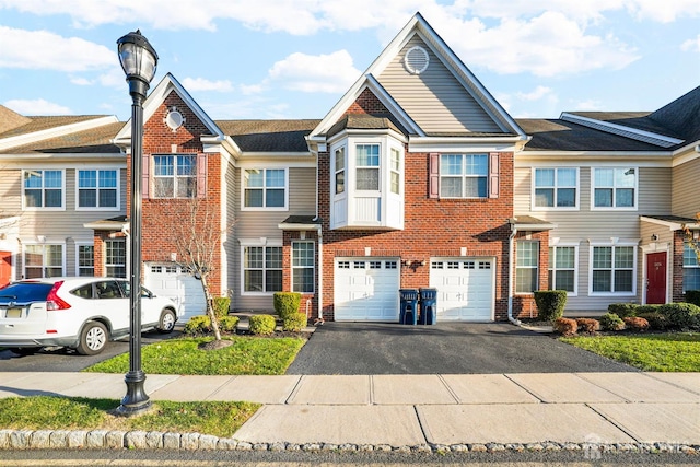 multi unit property featuring a garage