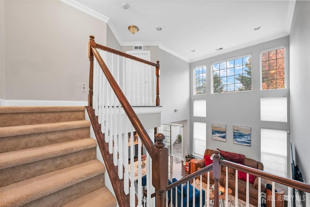 staircase featuring ornamental molding