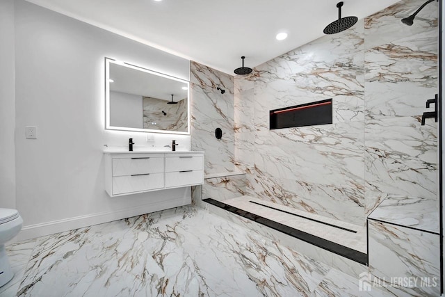 full bath featuring double vanity, marble tiled floors, a marble finish shower, recessed lighting, and toilet