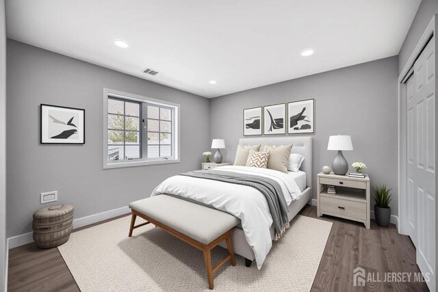 5 Chadwick Ln Unit D, Monroe, NJ 08831 - bedroom featuring a closet, dark wood finished floors, baseboards, and recessed lighting