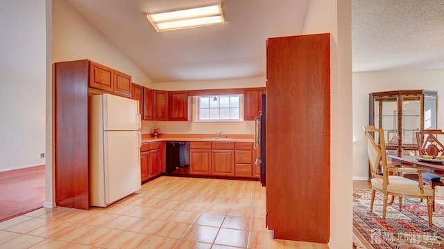 kitchen featuring lofted ceiling, white refrigerator, sink, dishwasher, and a textured ceiling