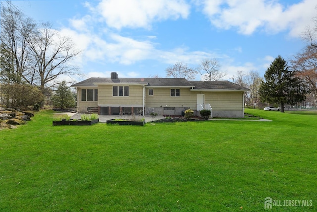 46 Thomas St, Monroe, NJ 08831 - back of property featuring a yard and a chimney