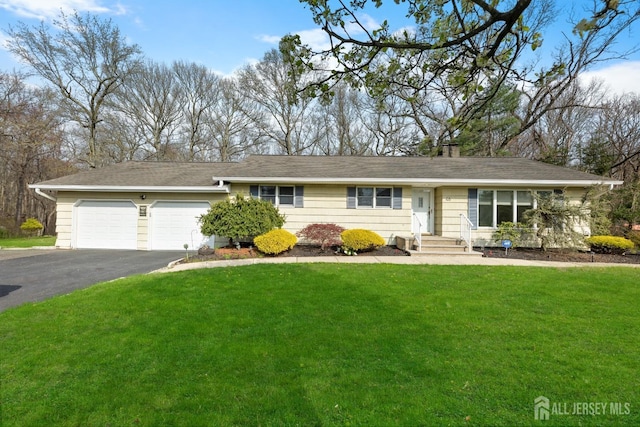 46 Thomas St, Monroe, NJ 08831 - single story home with a garage, asphalt driveway, a front yard, and a chimney