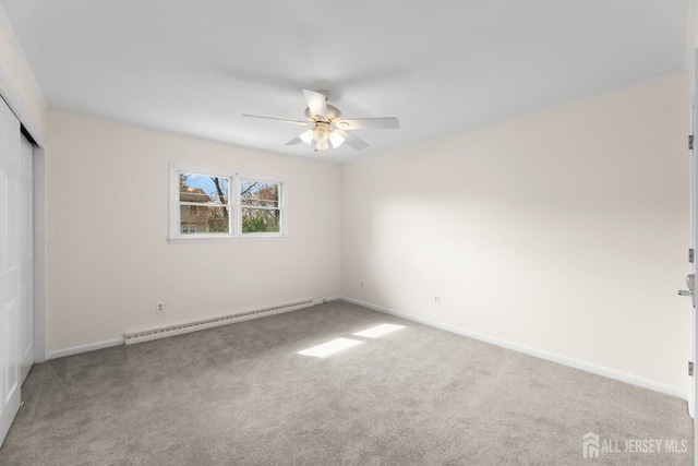 46 Thomas St, Monroe, NJ 08831 - unfurnished bedroom featuring baseboard heating, a closet, carpet, baseboards, and ceiling fan