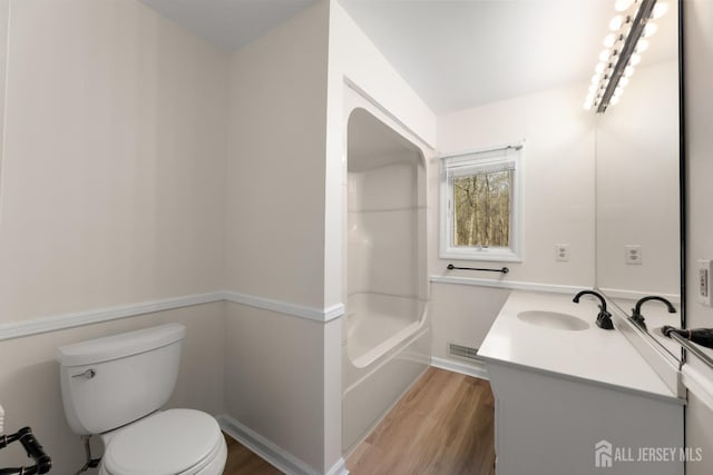 46 Thomas St, Monroe, NJ 08831 - full bath with wood finished floors, vanity, toilet, and shower / bathtub combination