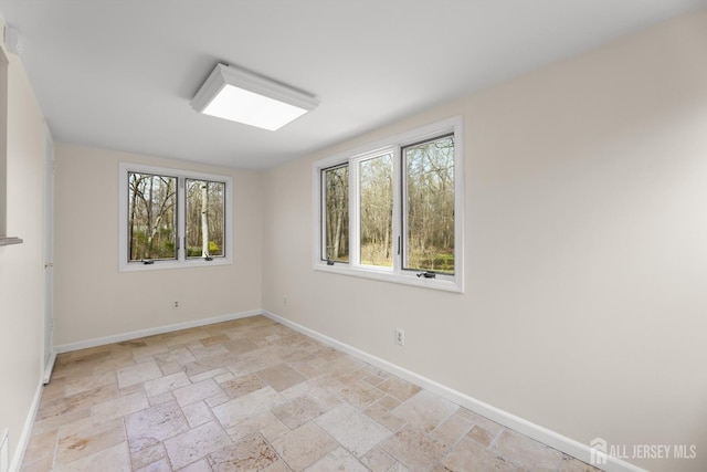 46 Thomas St, Monroe, NJ 08831 - unfurnished room featuring stone tile floors and baseboards