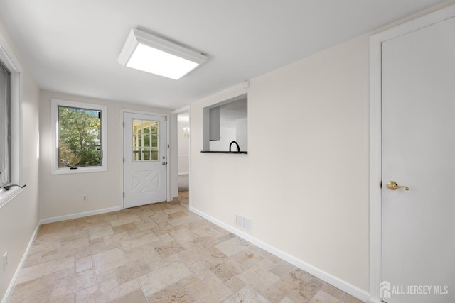46 Thomas St, Monroe, NJ 08831 - entryway featuring baseboards and stone tile flooring
