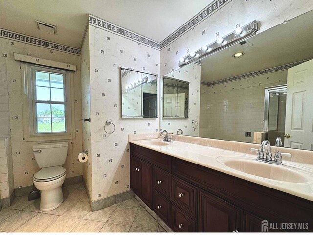 38 Rutland Ln Unit I, Monroe, NJ 08831 - full bathroom featuring double vanity, toilet, tile patterned flooring, baseboards, and a shower