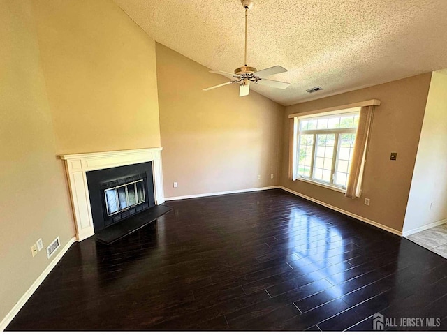 38 Rutland Ln Unit I, Monroe, NJ 08831 - unfurnished living room with a textured ceiling, wood finished floors, lofted ceiling, a ceiling fan, and baseboards