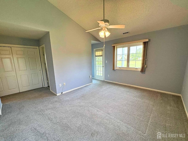 38 Rutland Ln Unit I, Monroe, NJ 08831 - unfurnished bedroom featuring lofted ceiling, baseboards, carpet, a textured ceiling, and ceiling fan