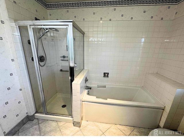 38 Rutland Ln Unit I, Monroe, NJ 08831 - full bath with tile patterned flooring, a garden tub, a shower stall, baseboards, and toilet
