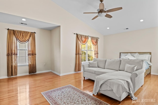 bedroom with lofted ceiling and light hardwood / wood-style flooring