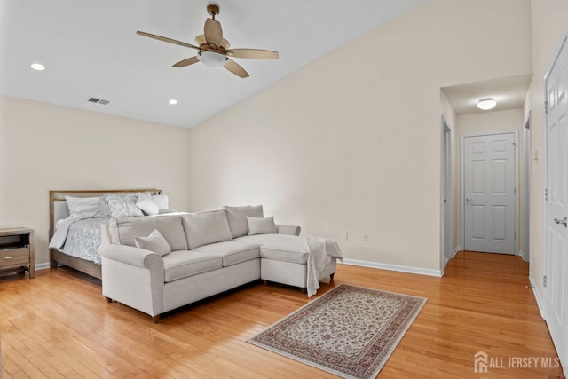 bedroom featuring high vaulted ceiling, hardwood / wood-style flooring, and ceiling fan