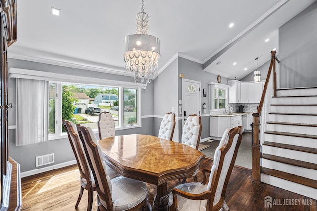 59 Mckinley Ave, Colonia, NJ 07067 - dining area with ornamental molding, wood finished floors, stairway, a chandelier, and recessed lighting